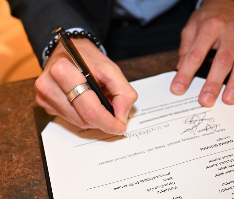 Wedding ceremony sign by brother witness