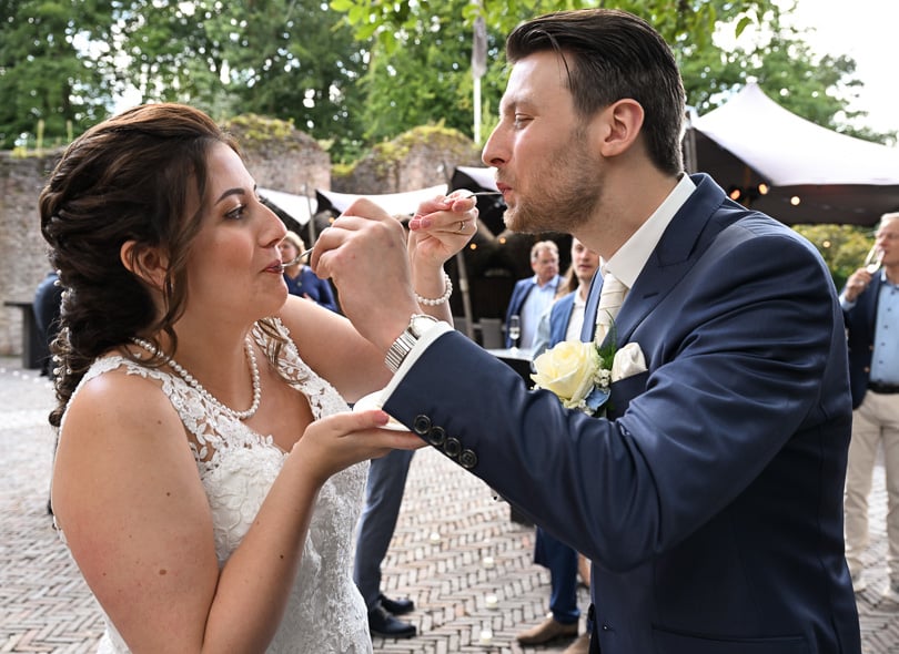 Wedding couple eating their wedding cake