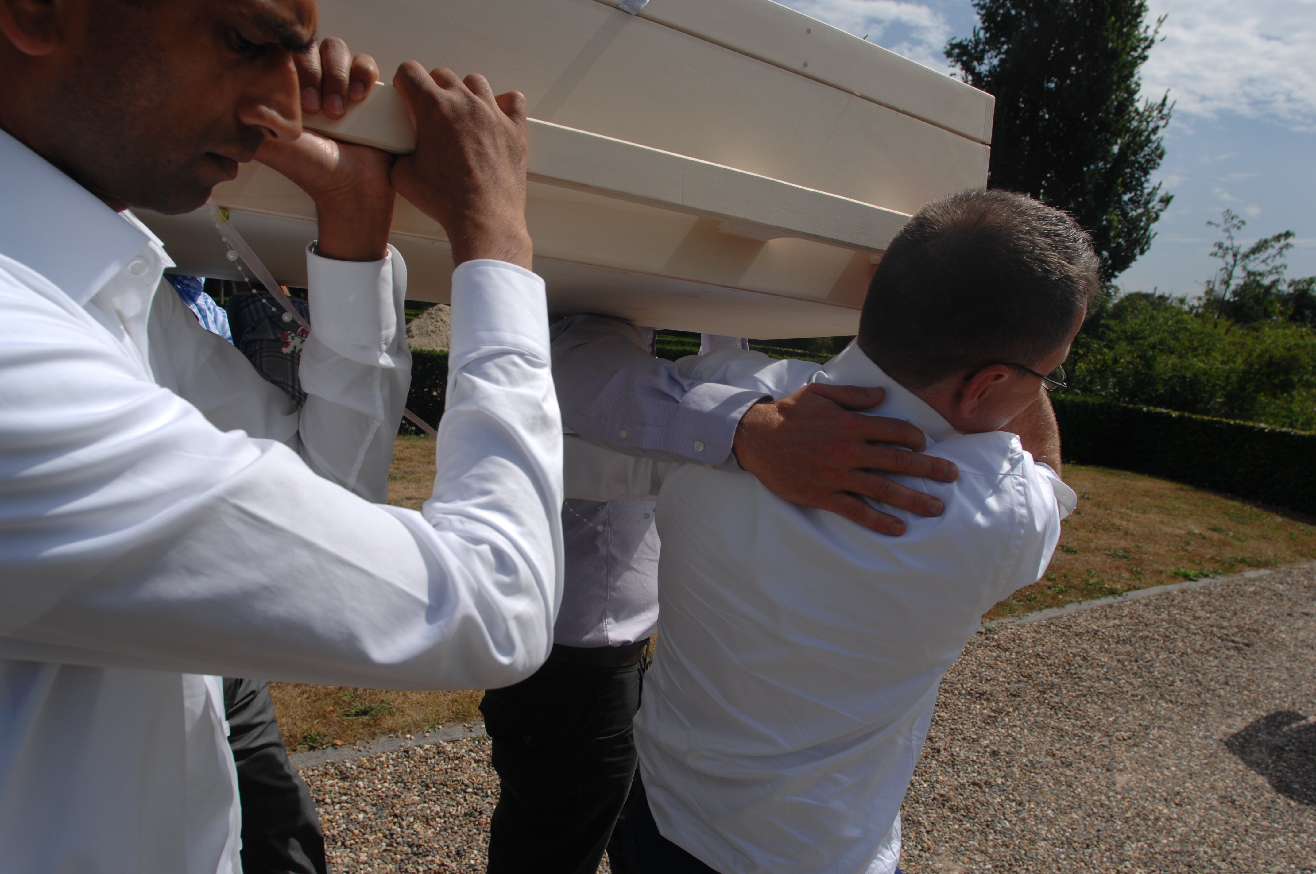 Close up carrying coffin mother