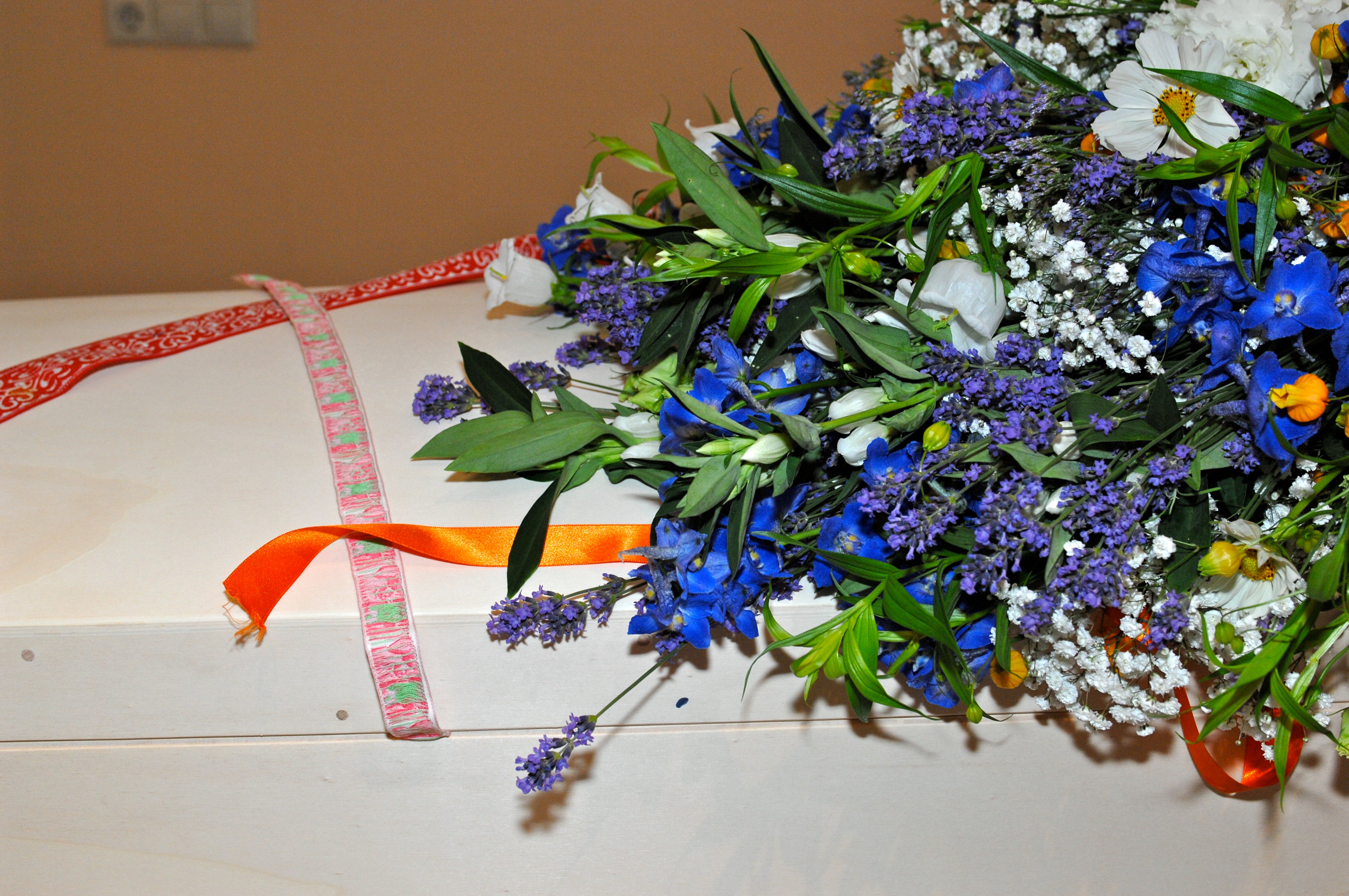 Funeral flowers on coffin