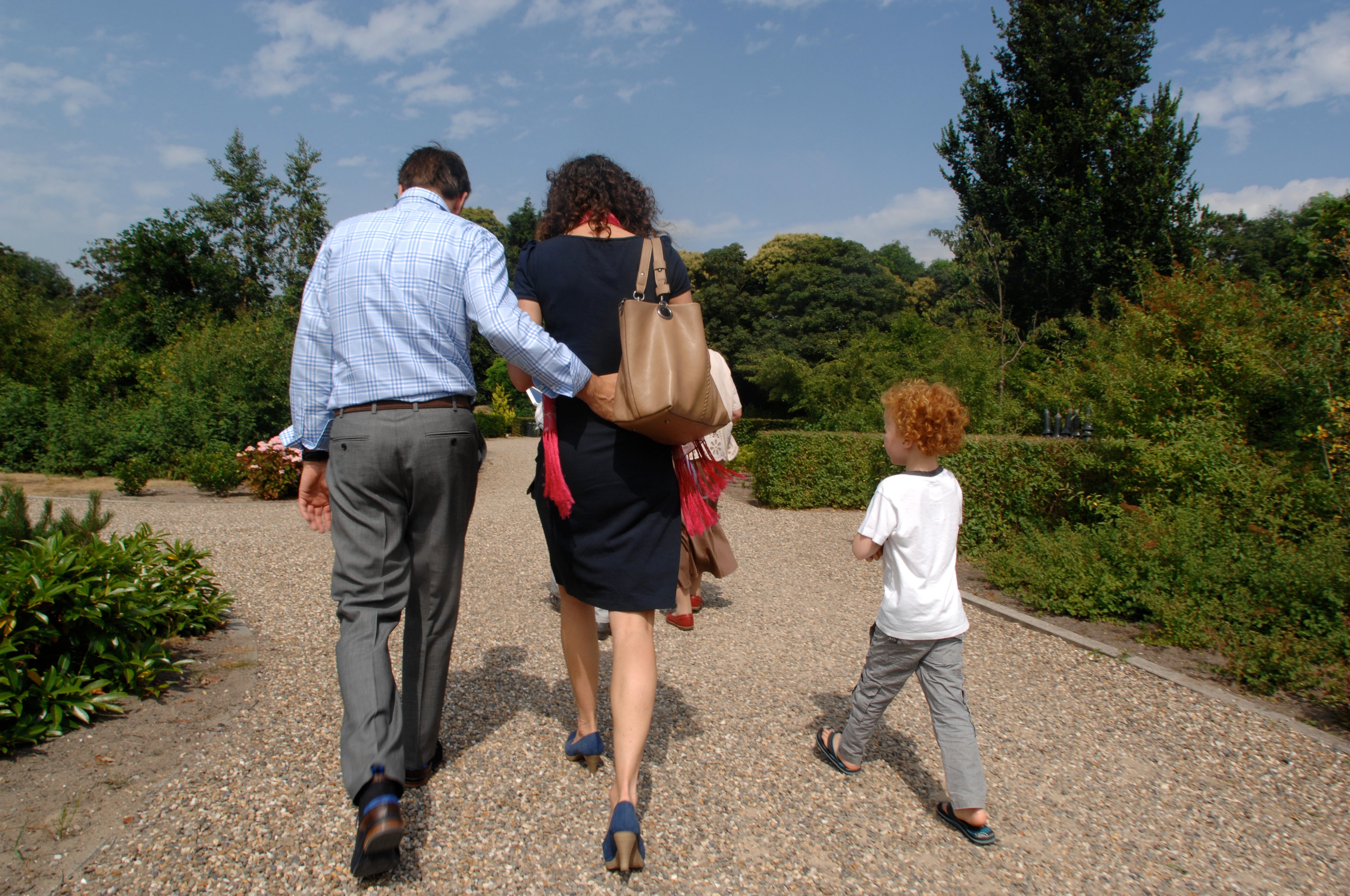 Family leaving graveyard